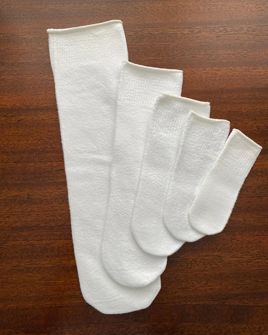 Heel-less ankle interface sock Wrinkle free and form fitting Added stretch for ease with donning and doffing Completely seamless knitting, super soft fit 92% CoolMax™ polyester, 2% Lycra, 6% Nylon Maximum wicking fibers keeps foot dry, comfortable and odor free Resists shrinking Made in the USA